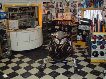 TSR showroom with snowmobile and parts counter
